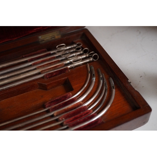 1257 - A mid 19th century mahogany cased medical set of catheter surgical instruments, inset plate to the l... 