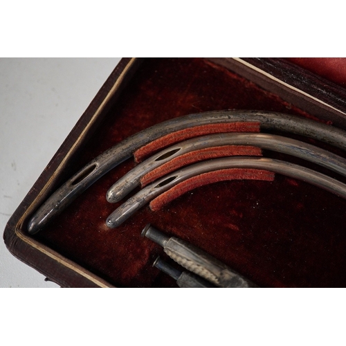 1258 - A late 19th century leather cased medical set of catheter surgical instruments, together with a sing... 