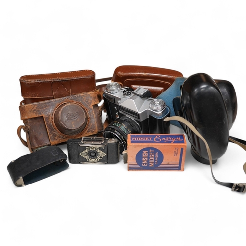 1271 - A Leica Model II camera in its original leather case, No. 204618, together with four additional came... 