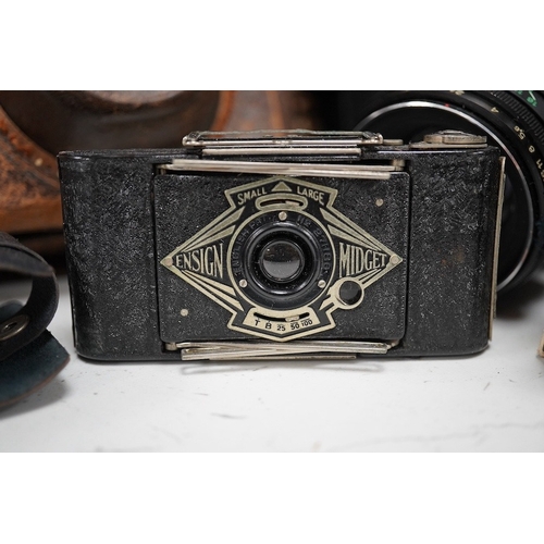 1271 - A Leica Model II camera in its original leather case, No. 204618, together with four additional came... 