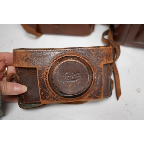 1271 - A Leica Model II camera in its original leather case, No. 204618, together with four additional came... 