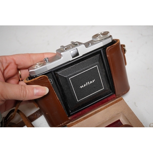 1271 - A Leica Model II camera in its original leather case, No. 204618, together with four additional came... 