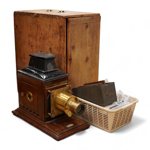 1273 - A mahogany and brass magic lantern in pine box, and a quantity of magic lantern slides by Primus, et... 