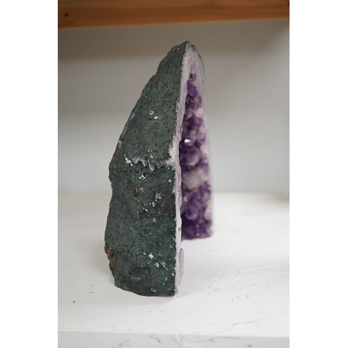 1280 - An amethyst geode specimen, 21.5cm high, 20.5cm wide at the base. Condition - fair to good.