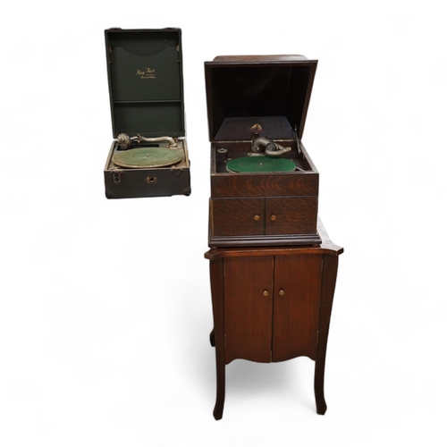 1285 - Two gramophone players; an oak cased HMV tabletop gramophone on a similar style mahogany gramophone ... 