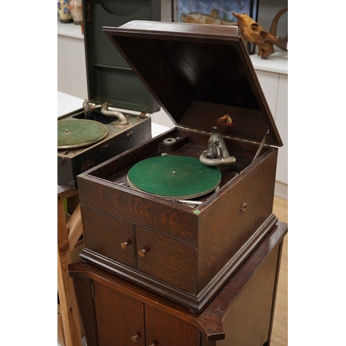 1285 - Two gramophone players; an oak cased HMV tabletop gramophone on a similar style mahogany gramophone ... 