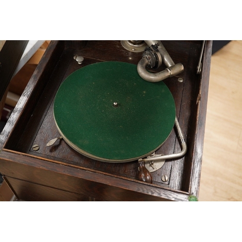 1285 - Two gramophone players; an oak cased HMV tabletop gramophone on a similar style mahogany gramophone ... 