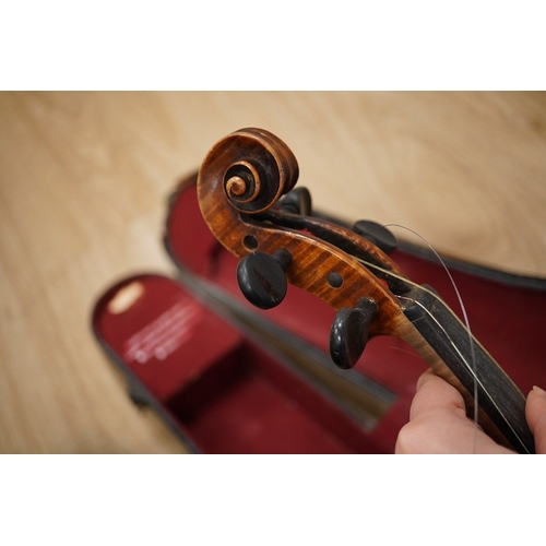 1287 - Two cased violins; one French 19th century bearing a hand written label for Francesco Werentle 1746,... 