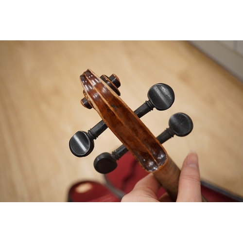 1287 - Two cased violins; one French 19th century bearing a hand written label for Francesco Werentle 1746,... 