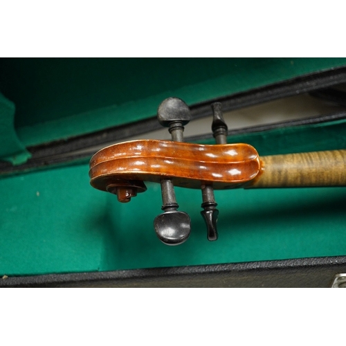 1289 - Four cased violins; an early 20th century violin, body 36cm, fitted with a microphone pick up taking... 