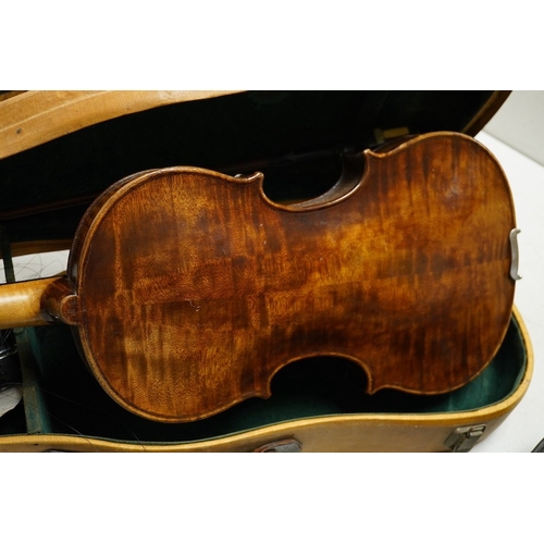 1289 - Four cased violins; an early 20th century violin, body 36cm, fitted with a microphone pick up taking... 