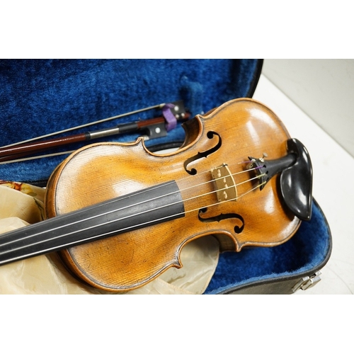 1289 - Four cased violins; an early 20th century violin, body 36cm, fitted with a microphone pick up taking... 