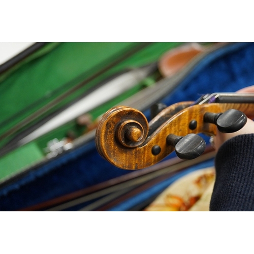 1289 - Four cased violins; an early 20th century violin, body 36cm, fitted with a microphone pick up taking... 