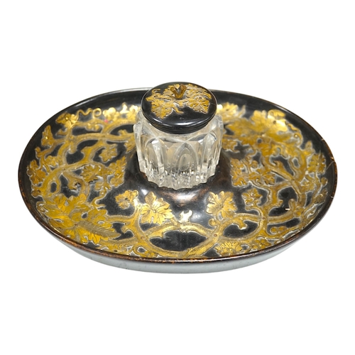 1331 - A Victorian ebonised and brass overlaid inkstand with cut glass ink well, 27cm wide. Condition - poo... 