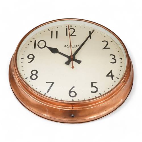 1332 - A copper Magneta Electric wall clock, with Arabic dial 53cm in diameter. Condition - fair/good, unte... 