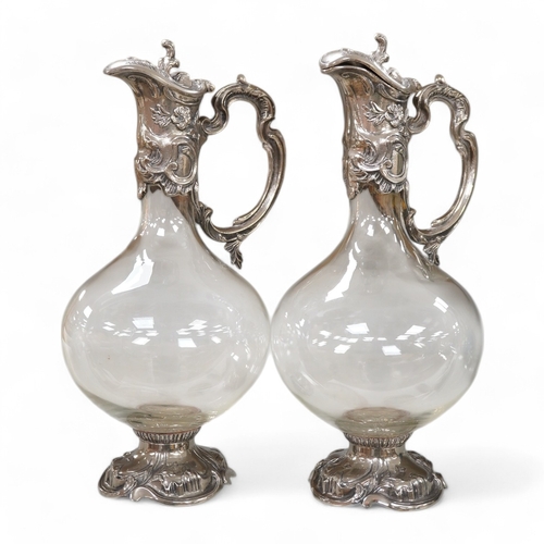 1334 - A pair of Art Nouveau style glass and silver plate mounted claret jugs, 31cm. Condition - good... 