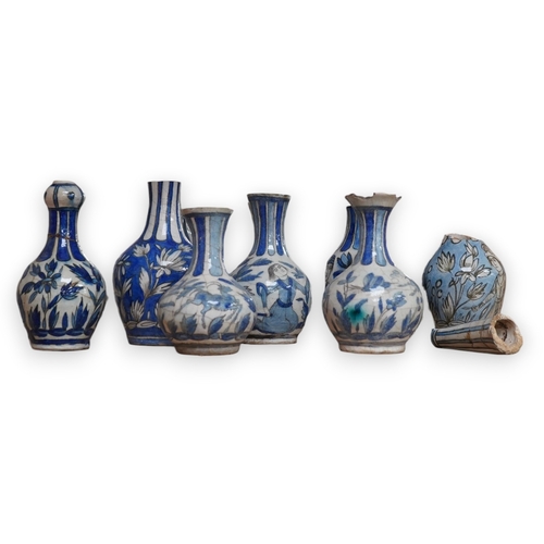 1343 - A large collection of Persian, predominantly blue and white, guglets, 18th century, largest 21.5cm. ... 