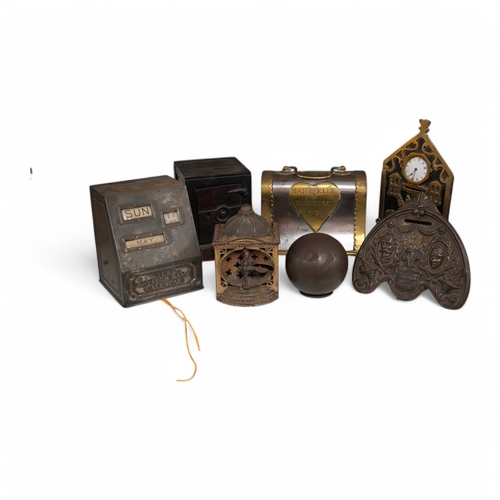 1345 - Six various metalware money boxes to include a cannonball money box, a safe money box, a George ... 