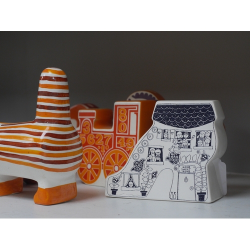 1349 - Seven mostly Carlton Ware 1960s-1970s money boxes to include examples in the form of a snail, trai... 