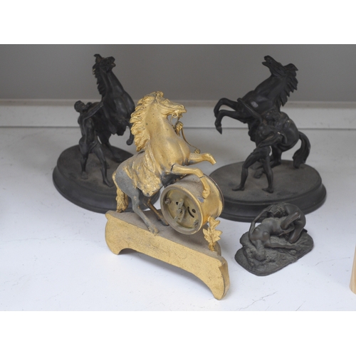 1355 - Two Spelter Marley horse groups, a similar timepiece and a bronzed resin erotic figure group after J... 