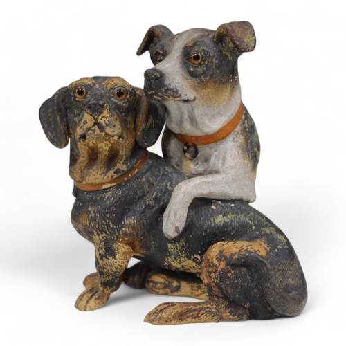 1370 - An Austrian cold painted terracotta model of a terrier and dachshund, 19cm high. Condition - one paw... 