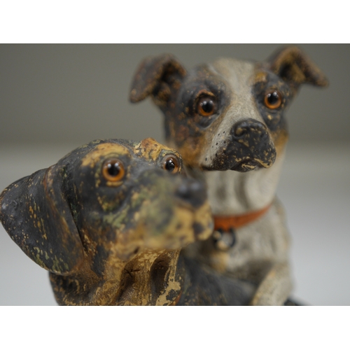 1370 - An Austrian cold painted terracotta model of a terrier and dachshund, 19cm high. Condition - one paw... 