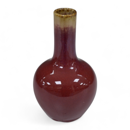 1377 - A Chinese sang de boeuf bottle vase, 18cm. Condition - good