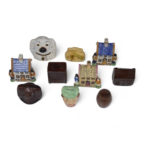 1378 - A group of ten novelty money boxes, including Staffordshire and glazed pottery money boxes, tallest ... 