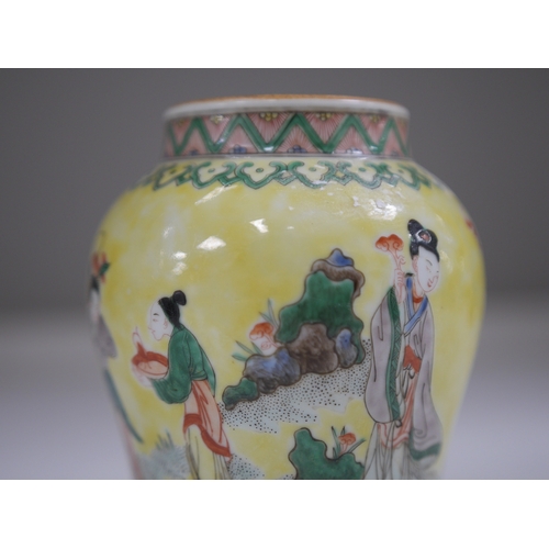 1382 - A Chinese yellow ground figurative vase, 15.5cm high. Condition - good