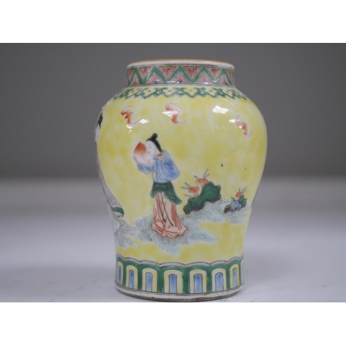 1382 - A Chinese yellow ground figurative vase, 15.5cm high. Condition - good