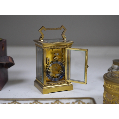 1388 - A brass cased carriage clock and five ormolu mounted glass desk accessories, clock 12cm high. Condit... 