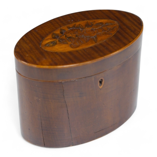 1392 - A George III oval inlaid sycamore tea caddy, 12cm high x 15cm wide. Condition - two splits to front.... 