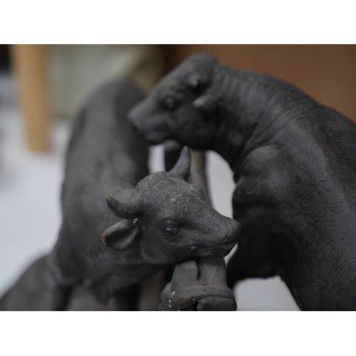 1403 - After Pierre-Jules Mêne (1810-1879), patinated metal group of bulls, 31cm high x 50cm wide. Conditio... 