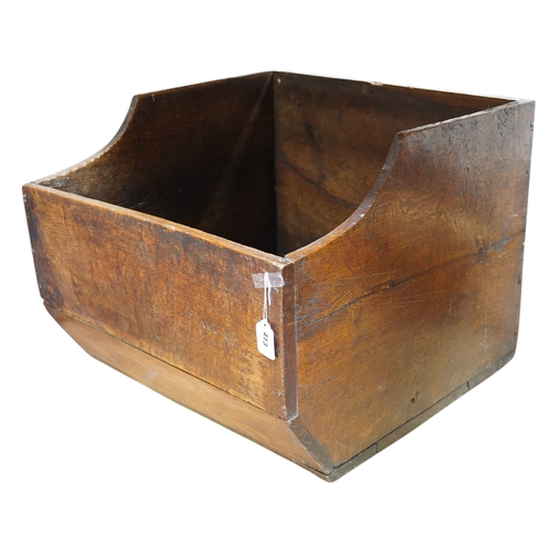 1411 - An early 20th century oak dog basket, 65cm wide. Condition - fair