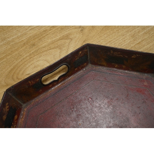 1412 - An early 19th century octagonal red painted toleware tray, possibly Pontypool, 66cm wide. Condition ... 