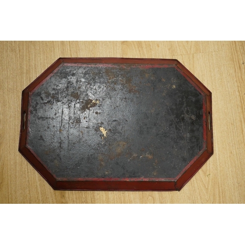 1412 - An early 19th century octagonal red painted toleware tray, possibly Pontypool, 66cm wide. Condition ... 