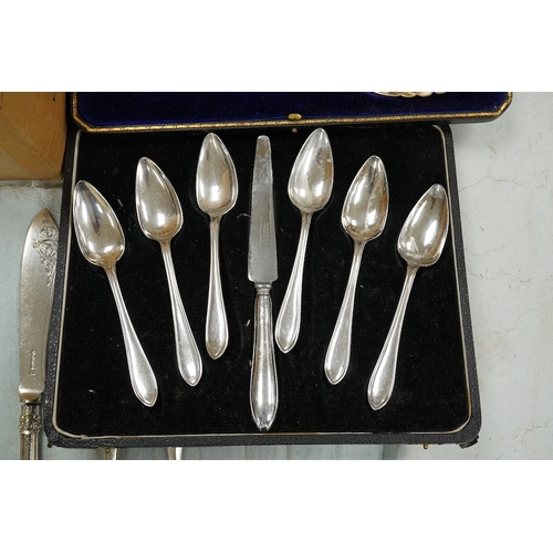 1413 - A cased set of six silver grapefruits spoons with a silver handled carving knife and a quantity of a... 