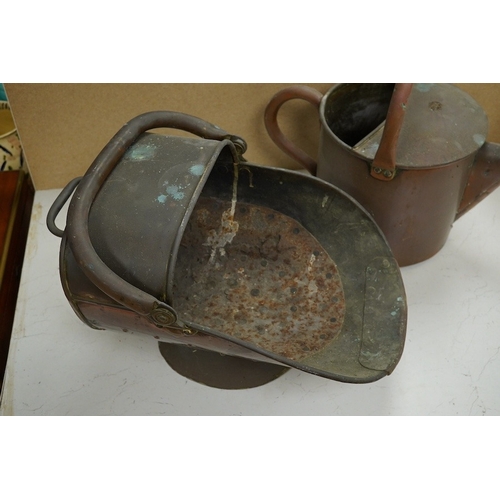 1414 - A copper watering can and a helmet coal scuttle, watering can 40cm high. Condition - interior of coa... 