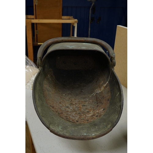 1414 - A copper watering can and a helmet coal scuttle, watering can 40cm high. Condition - interior of coa... 