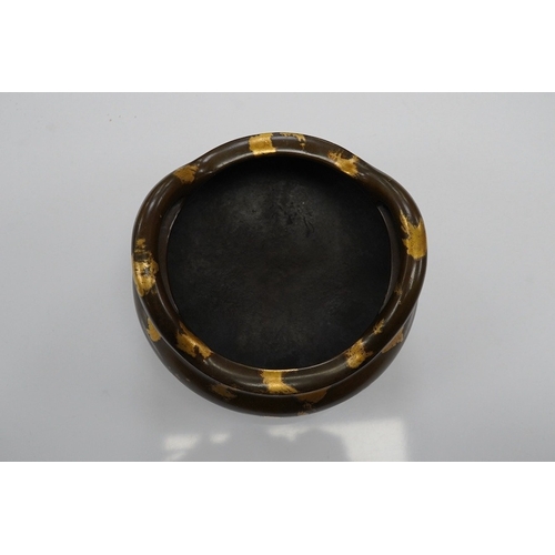 1419 - A Chinese gold splash bronze censer, Xuande seal mark to underside, 11cm wide. Condition - good... 