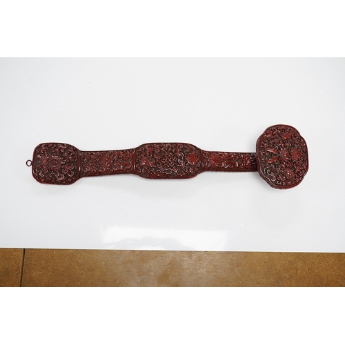 1420 - A Chinese red lacquered Ruyi sceptre, 41cm. Condition - fair to good