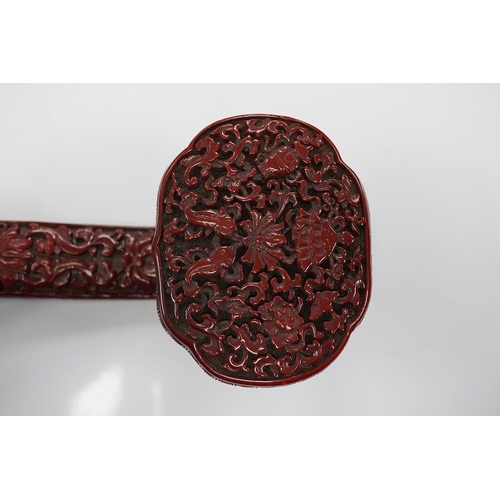 1420 - A Chinese red lacquered Ruyi sceptre, 41cm. Condition - fair to good