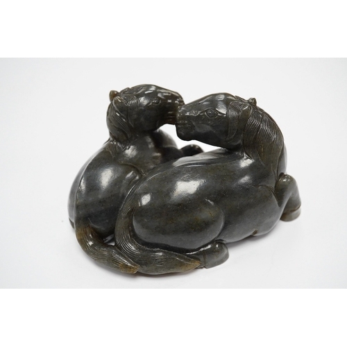 1421 - A Chinese carved grey jade group of two recumbent horses, 10cm wide. Condition - good