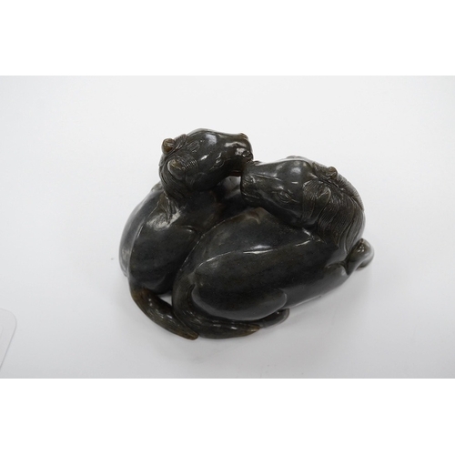 1421 - A Chinese carved grey jade group of two recumbent horses, 10cm wide. Condition - good