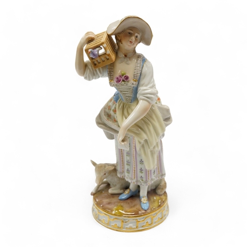 1424 - A 19th century Meissen figure of a shepherdess with a birdcage, incised F73, 18cm. Condition - fair... 