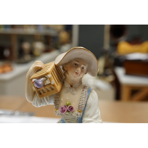 1424 - A 19th century Meissen figure of a shepherdess with a birdcage, incised F73, 18cm. Condition - fair... 