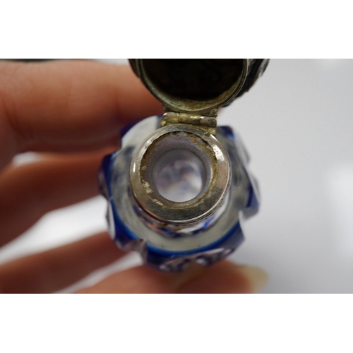 1436 - A 19th century silver topped blue overlay glass scent bottle, 11cm long. Condition - fine chips to b... 