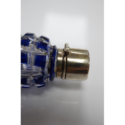 1437 - A 19th century blue overlay glass scent bottle with square ribbed design, 12cm long. Condition - goo... 