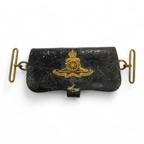 1438 - A Victorian Royal Artillery leather and brass cartridge pouch, 15cm wide. Condition - fair