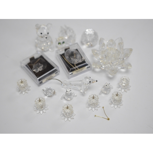 1444 - A collection of boxed Swarovski crystal figures. Condition - varies